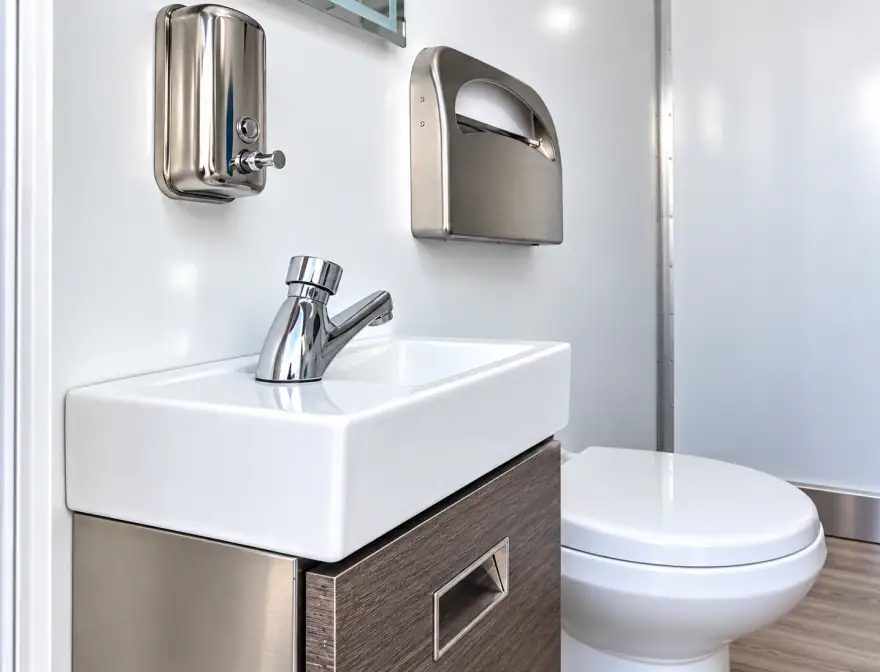 Commercial mobile restroom trailer interior with sink available rentals in Florida