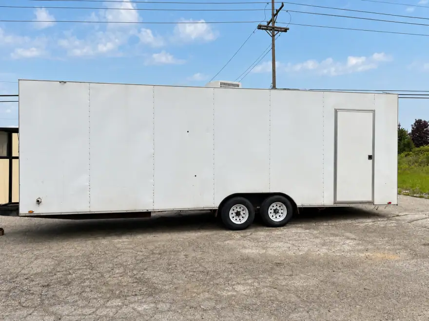 Dishwashing trailer for rent parked beside a temporary kitchen